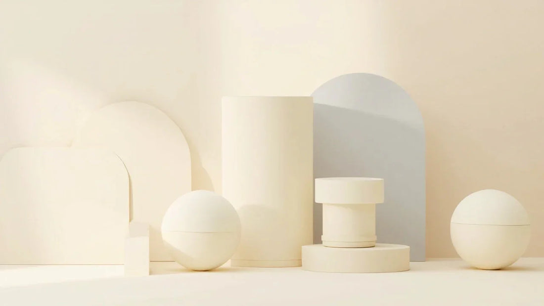 Minimalist beige geometric shapes and round containers on a soft neutral background
