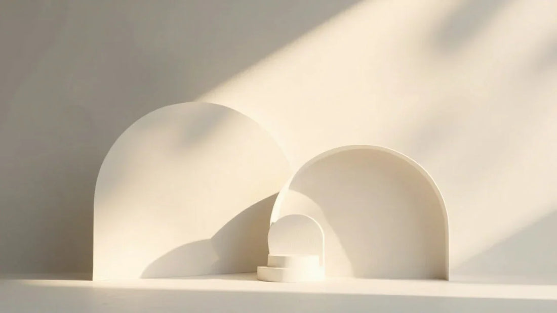Minimalist white abstract shapes with soft sunlight and elegant shadows on neutral background